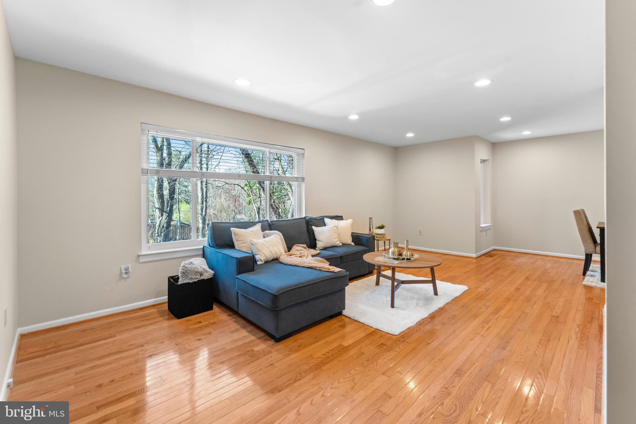 7512 Rolling Road Springfield, VA 22153 - Photo 4 of 32 a living room with furniture and a large window