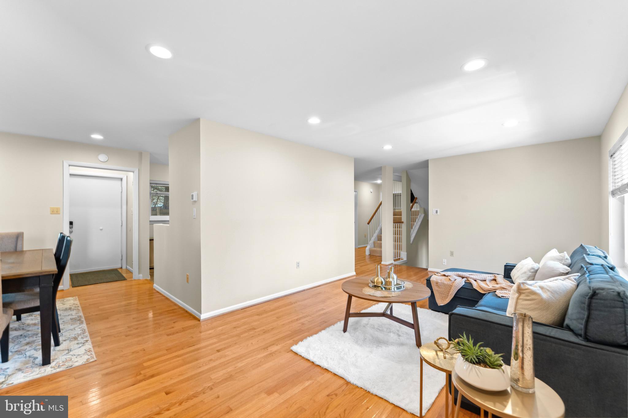 7512 Rolling Road Springfield, VA 22153 - Photo 5 of 32 a living room with furniture and a wooden floor