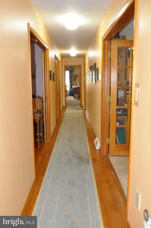 a view of a room with furniture and windows