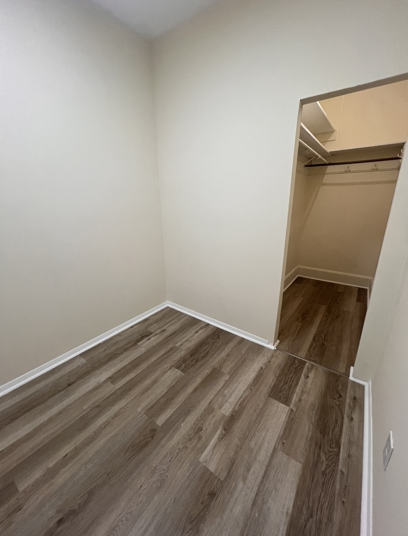 3741 South Union Avenue Chicago, IL 60609 - Photo 17 of 26 a view of empty room with wooden floor