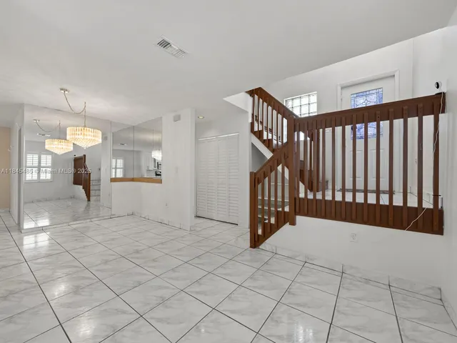 a view of an empty room and a window