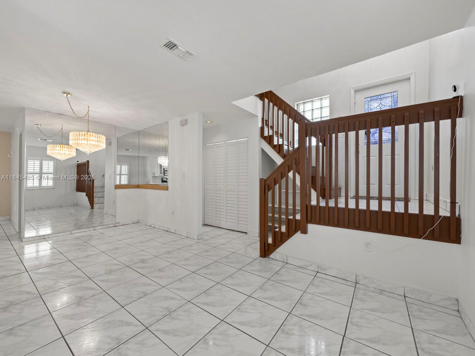 331 Northwest 101st Terrace Pembroke Pines, FL 33026 - Photo 11 of 42 a view of an empty room and a window