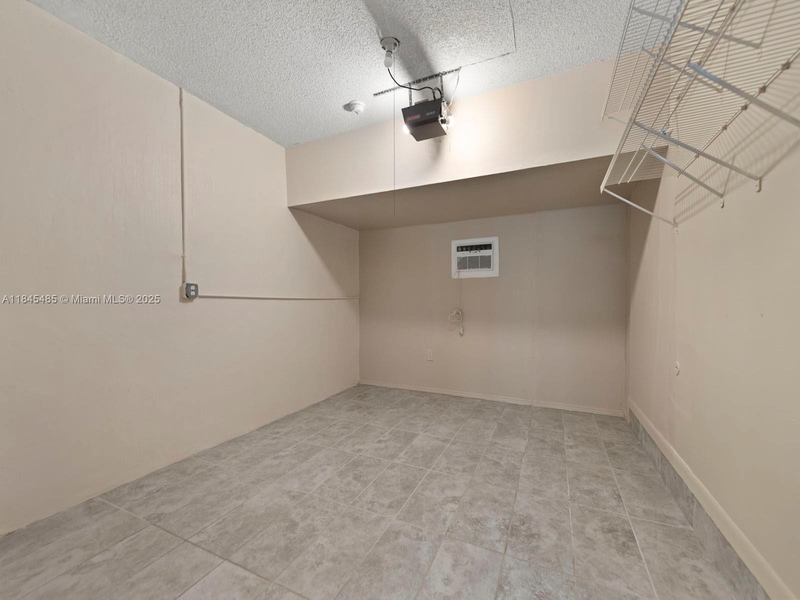 331 Northwest 101st Terrace Pembroke Pines, FL 33026 - Photo 21 of 42 an empty room with a ceiling fan and carpet