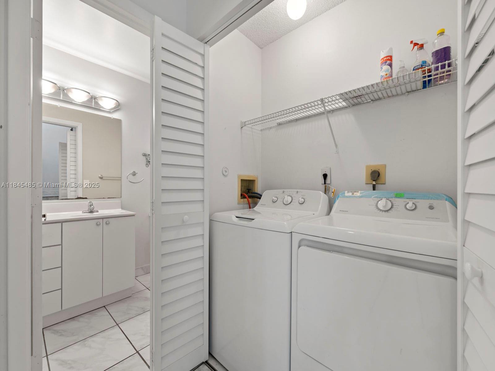 331 Northwest 101st Terrace Pembroke Pines, FL 33026 - Photo 22 of 42 a utility room with dryer and washer