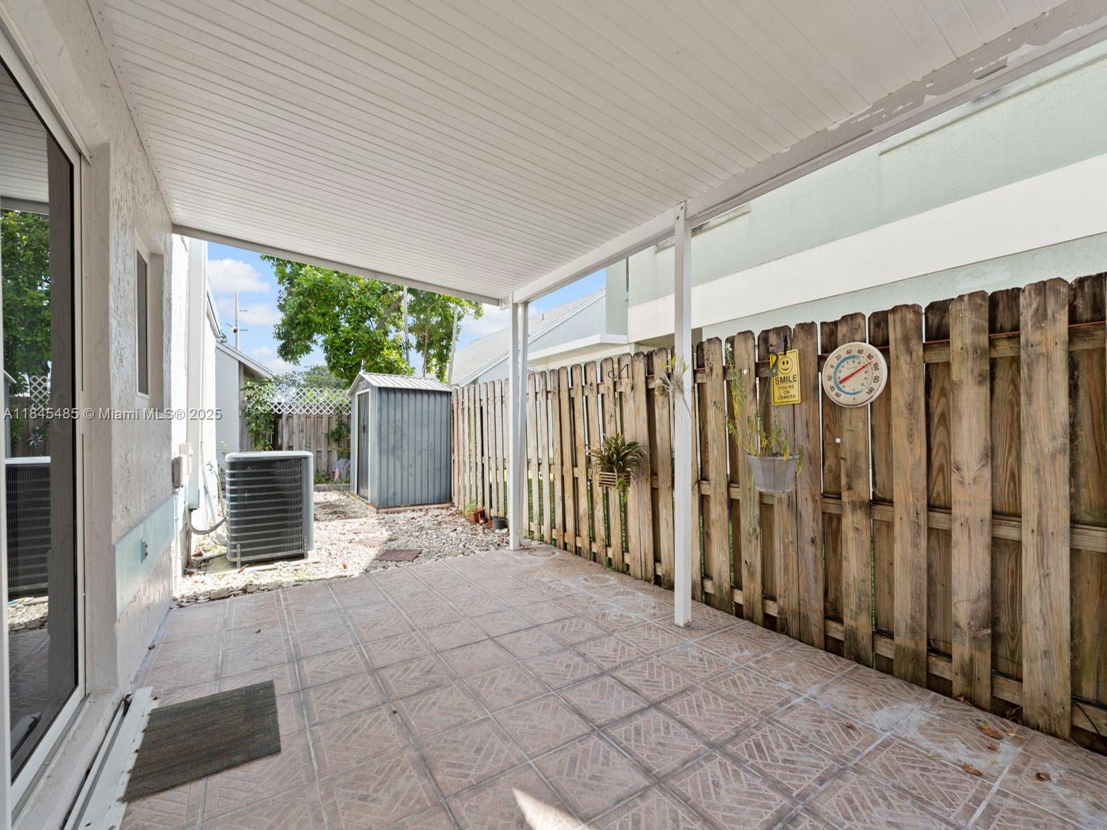 331 Northwest 101st Terrace Pembroke Pines, FL 33026 - Photo 24 of 42 a view of a porch with wooden floor and outdoor space