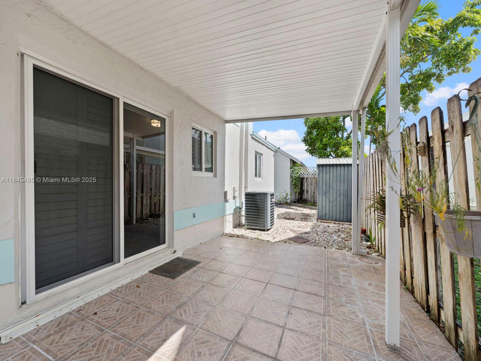 331 Northwest 101st Terrace Pembroke Pines, FL 33026 - Photo 27 of 42 a view of a house with backyard and sitting area