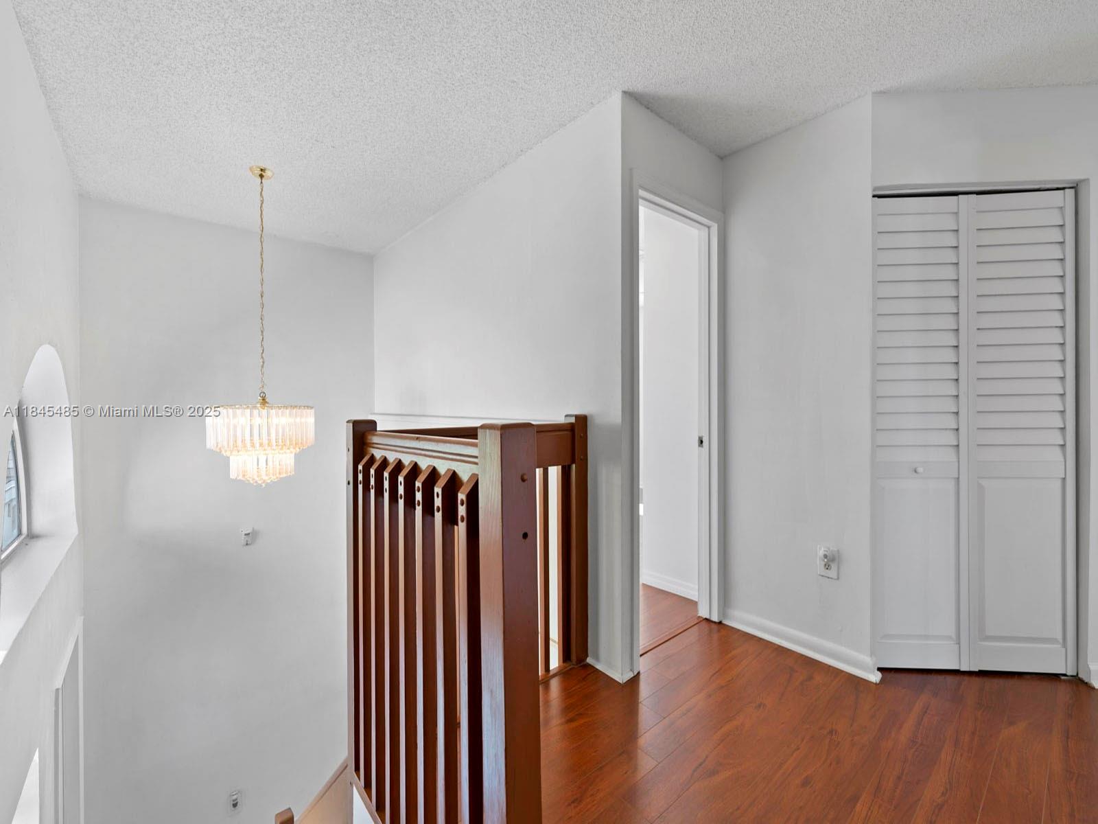 331 Northwest 101st Terrace Pembroke Pines, FL 33026 - Photo 28 of 42 a view of hallway with wooden floor