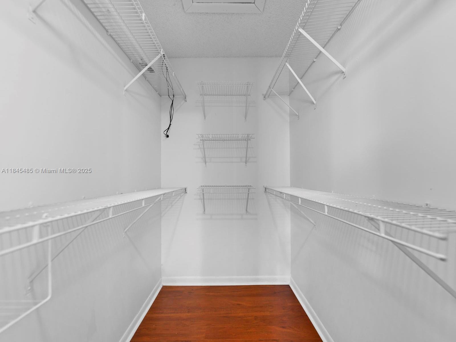 331 Northwest 101st Terrace Pembroke Pines, FL 33026 - Photo 34 of 42 a view of walk in closet with empty racks