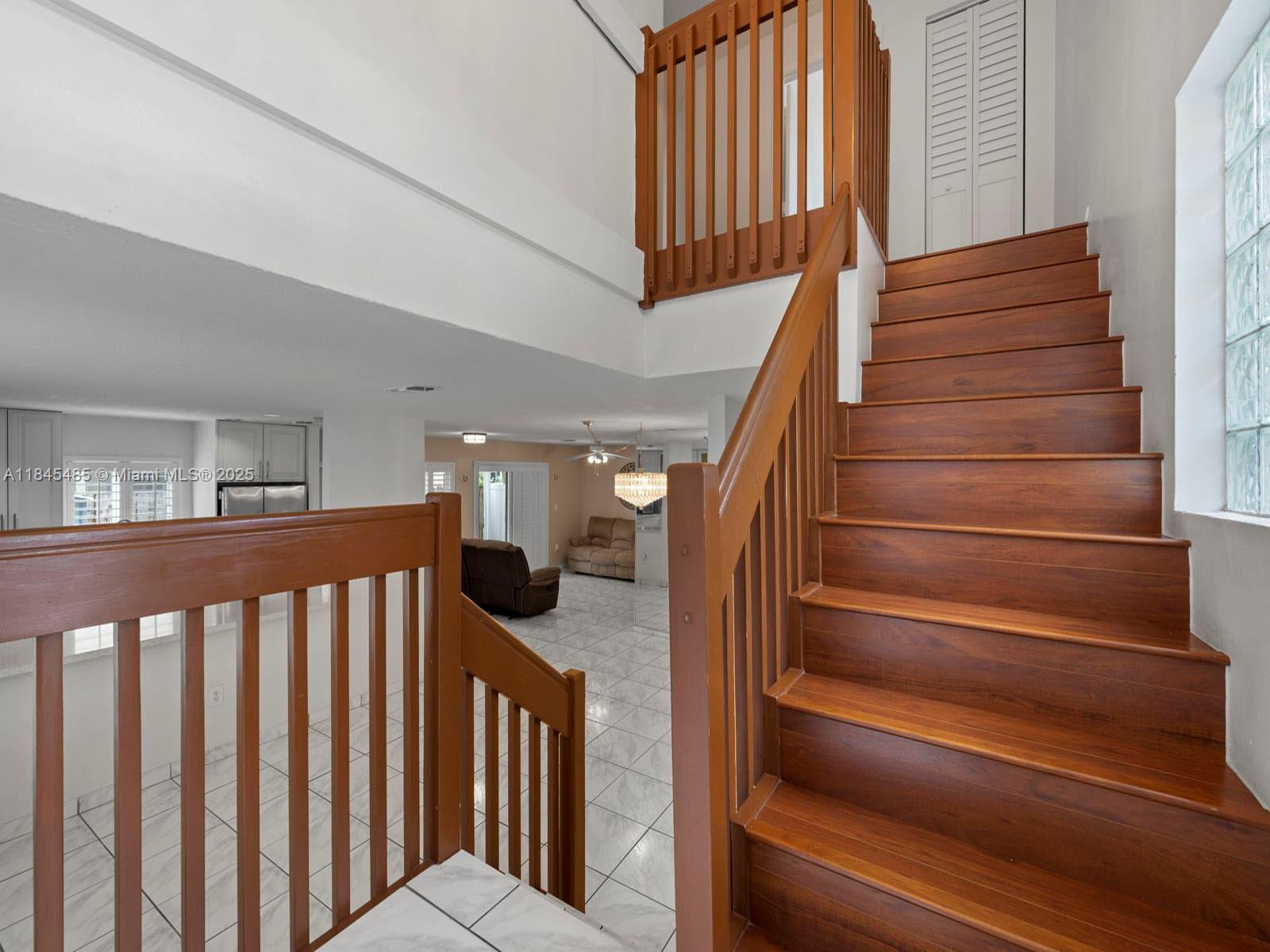 331 Northwest 101st Terrace Pembroke Pines, FL 33026 - Photo 8 of 42 a view of entryway and hall with wooden floor