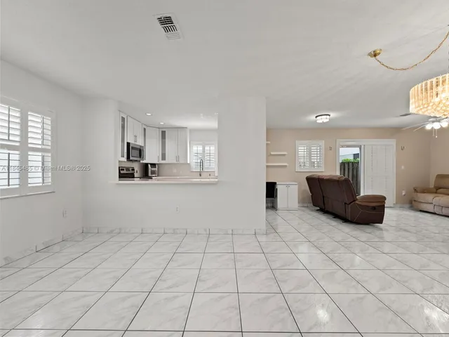 a view of a kitchen with furniture and cabinets