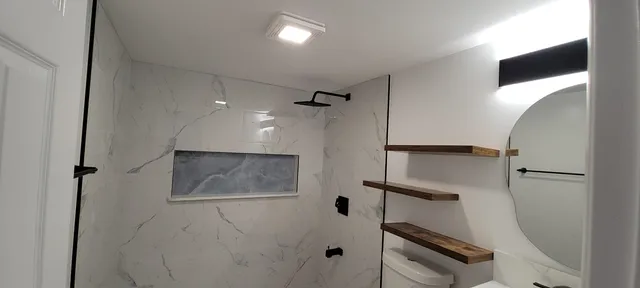 a view of a hallway with paintings on the wall