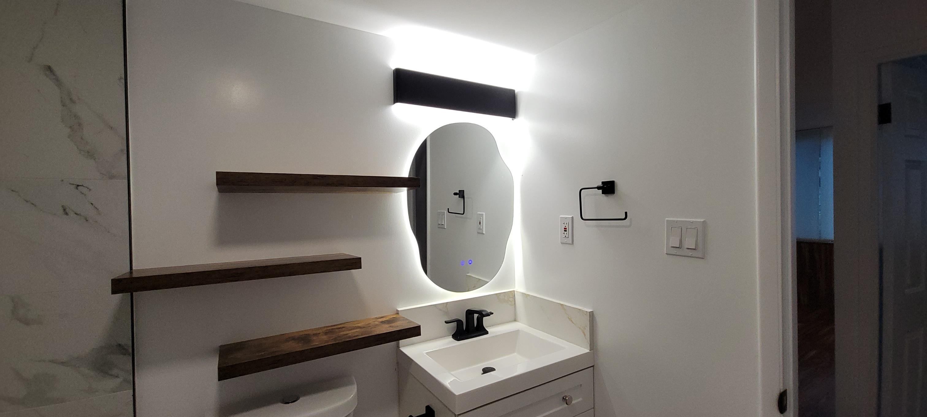 111 Kahului Beach Road, Unit A127 Kahului, HI 96732 - Photo 16 of 31 a bathroom with a sink and mirror