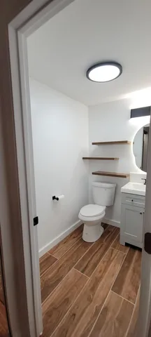 a bathroom with a toilet and a sink