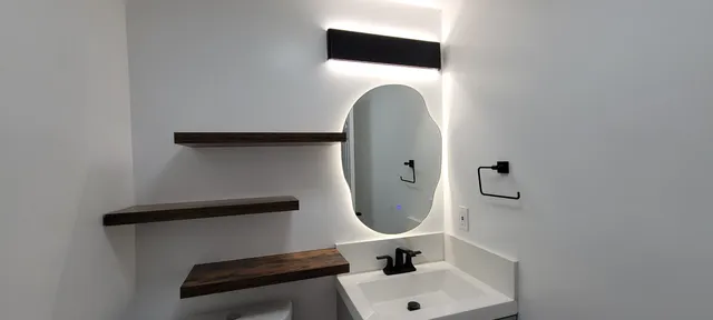 a bathroom with a sink and a mirror