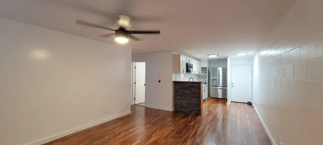 a view of a livingroom with wooden floor