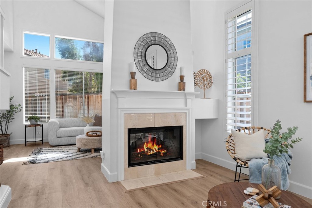 56 Acorn Ridge Rancho Santa Margarita, CA 92688 - Photo 10 of 57 Living Room / Fireplace: Another angle highlights the fireplace, vaulted ceiling, and open sightline toward the adjacent sitting area.