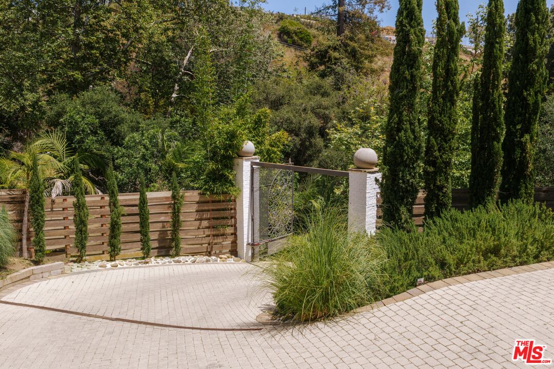 1105 Rivas Canyon Road Pacific Palisades, CA 90272 - Photo 3 of 49 a house view with a outdoor space