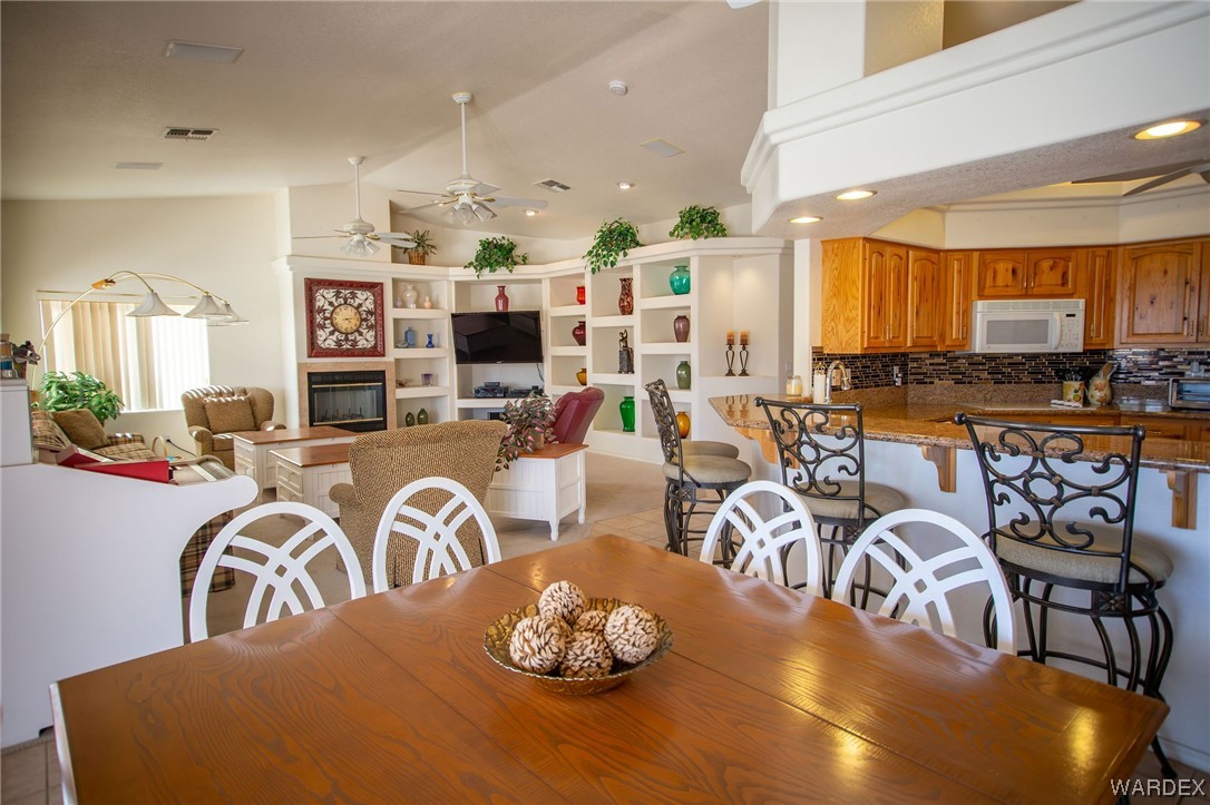 2660 Pegasus Ranch Road Bullhead City, AZ 86429 - Photo 13 of 57 a living room with lots of furniture and chandelier