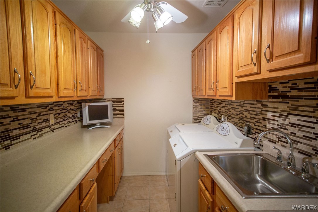 2660 Pegasus Ranch Road Bullhead City, AZ 86429 - Photo 19 of 57 a kitchen that has a sink and a stove