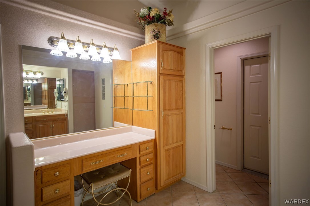 2660 Pegasus Ranch Road Bullhead City, AZ 86429 - Photo 26 of 57 a bathroom with a sink and a mirror