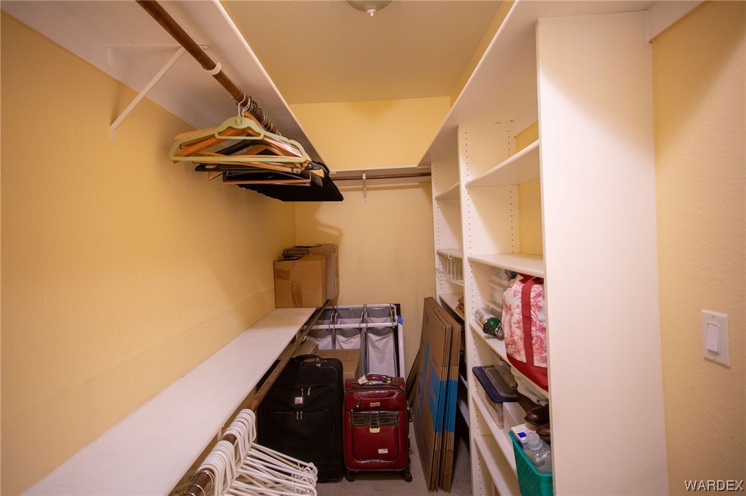 2660 Pegasus Ranch Road Bullhead City, AZ 86429 - Photo 29 of 57 a view of walk in closet with clothes and shoes