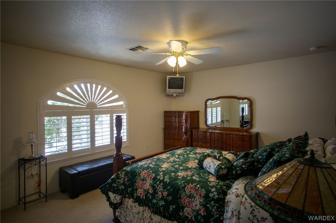 2660 Pegasus Ranch Road Bullhead City, AZ 86429 - Photo 36 of 57 a bedroom with bed and window