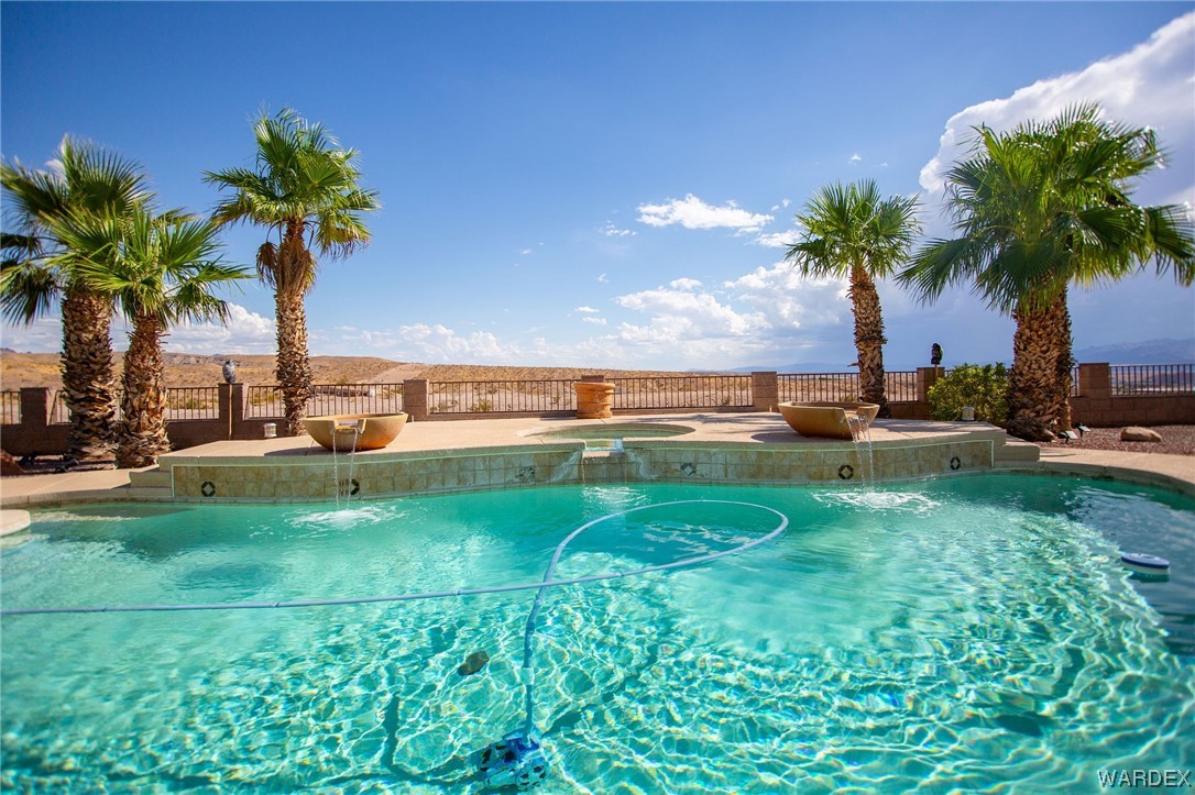 2660 Pegasus Ranch Road Bullhead City, AZ 86429 - Photo 50 of 57 a view of a swimming pool and tall trees