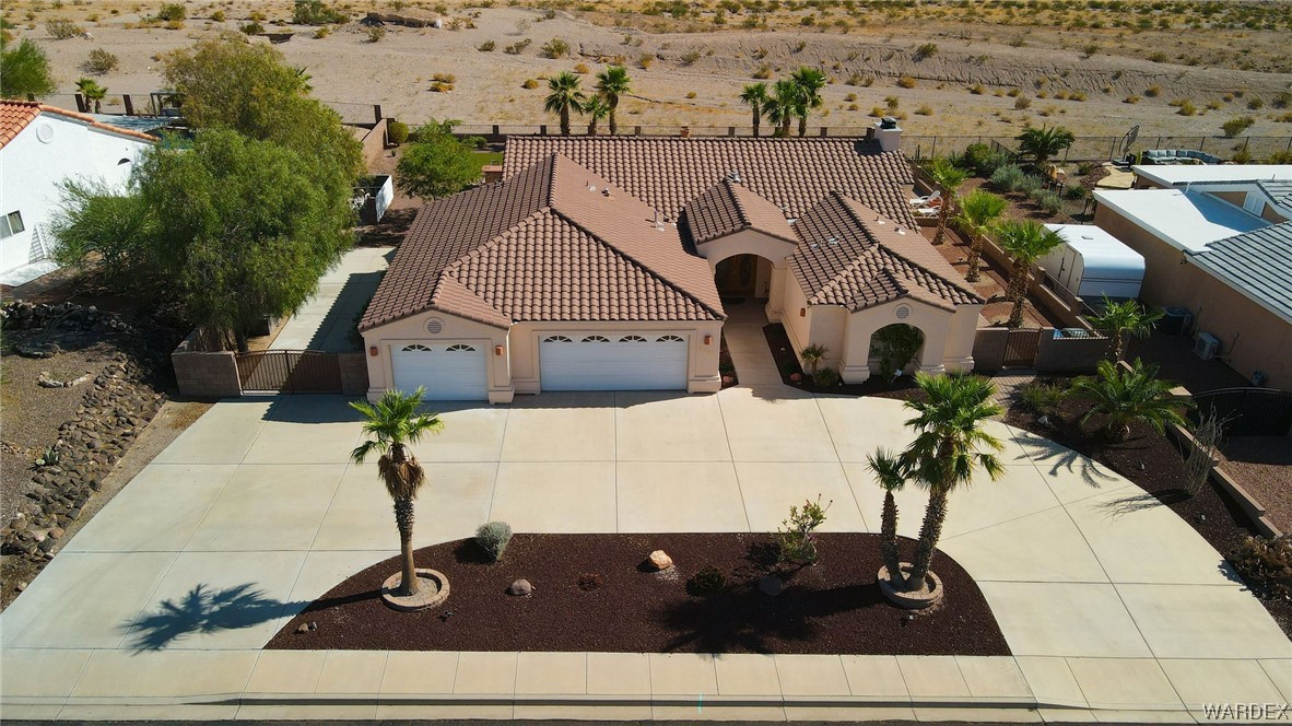 2660 Pegasus Ranch Road Bullhead City, AZ 86429 - Photo 5 of 57 a aerial view of a house with a yard