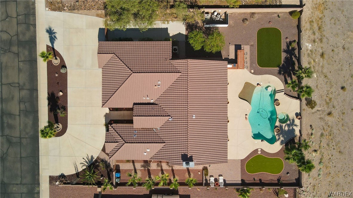 2660 Pegasus Ranch Road Bullhead City, AZ 86429 - Photo 55 of 57 an aerial view of a house with garden space and swimming pool