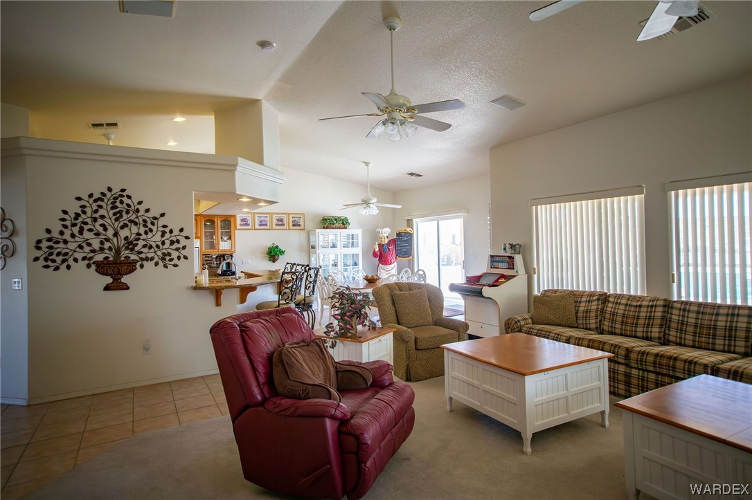 2660 Pegasus Ranch Road Bullhead City, AZ 86429 - Photo 7 of 57 a living room with furniture ceiling fan and a rug