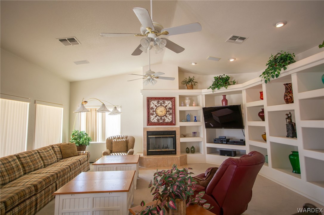 2660 Pegasus Ranch Road Bullhead City, AZ 86429 - Photo 10 of 57 a living room with fireplace furniture and a flat screen tv