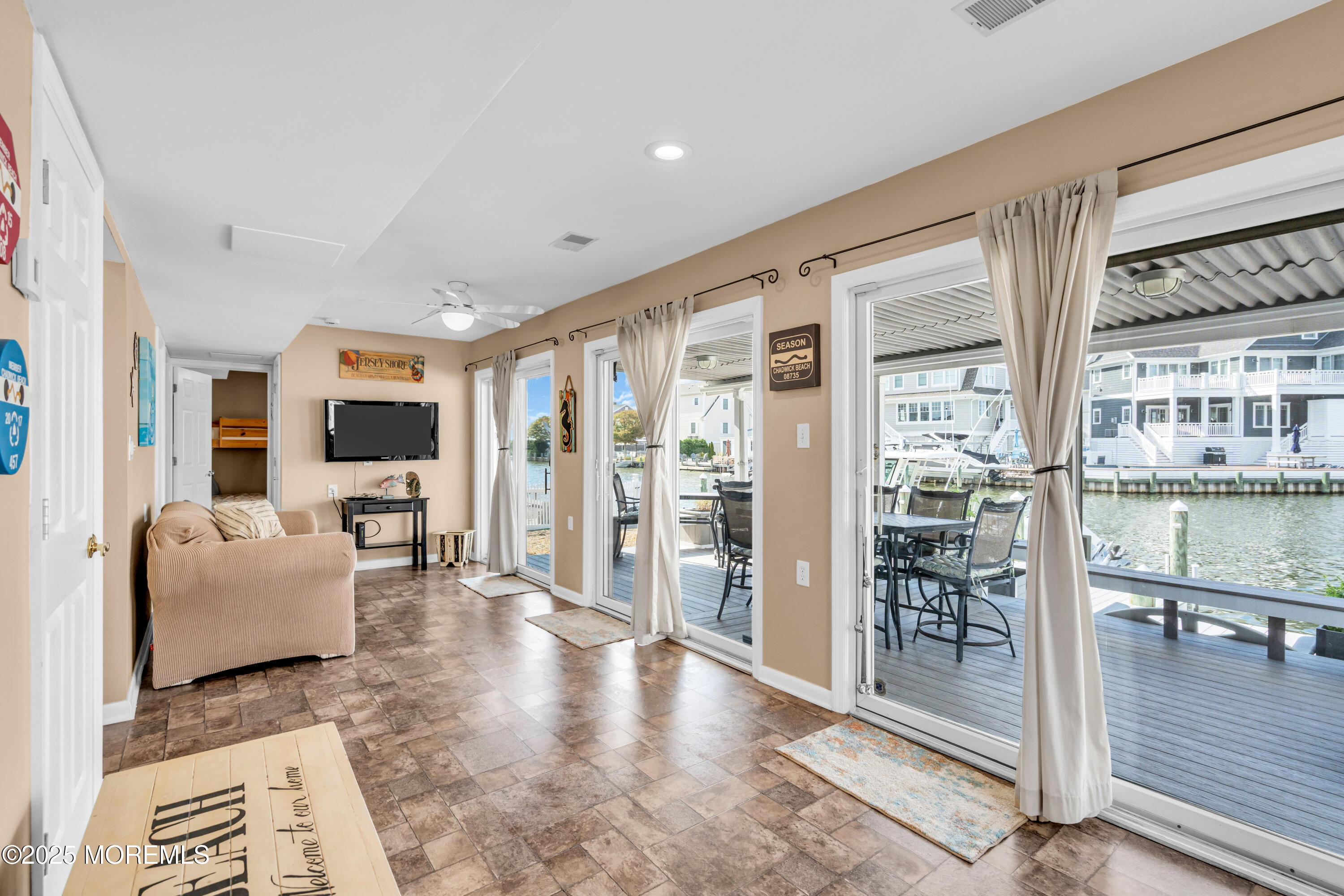 316 Ormond Drive Lavallette, NJ 08735 - Photo 22 of 29 a living room with furniture large window and wooden floor