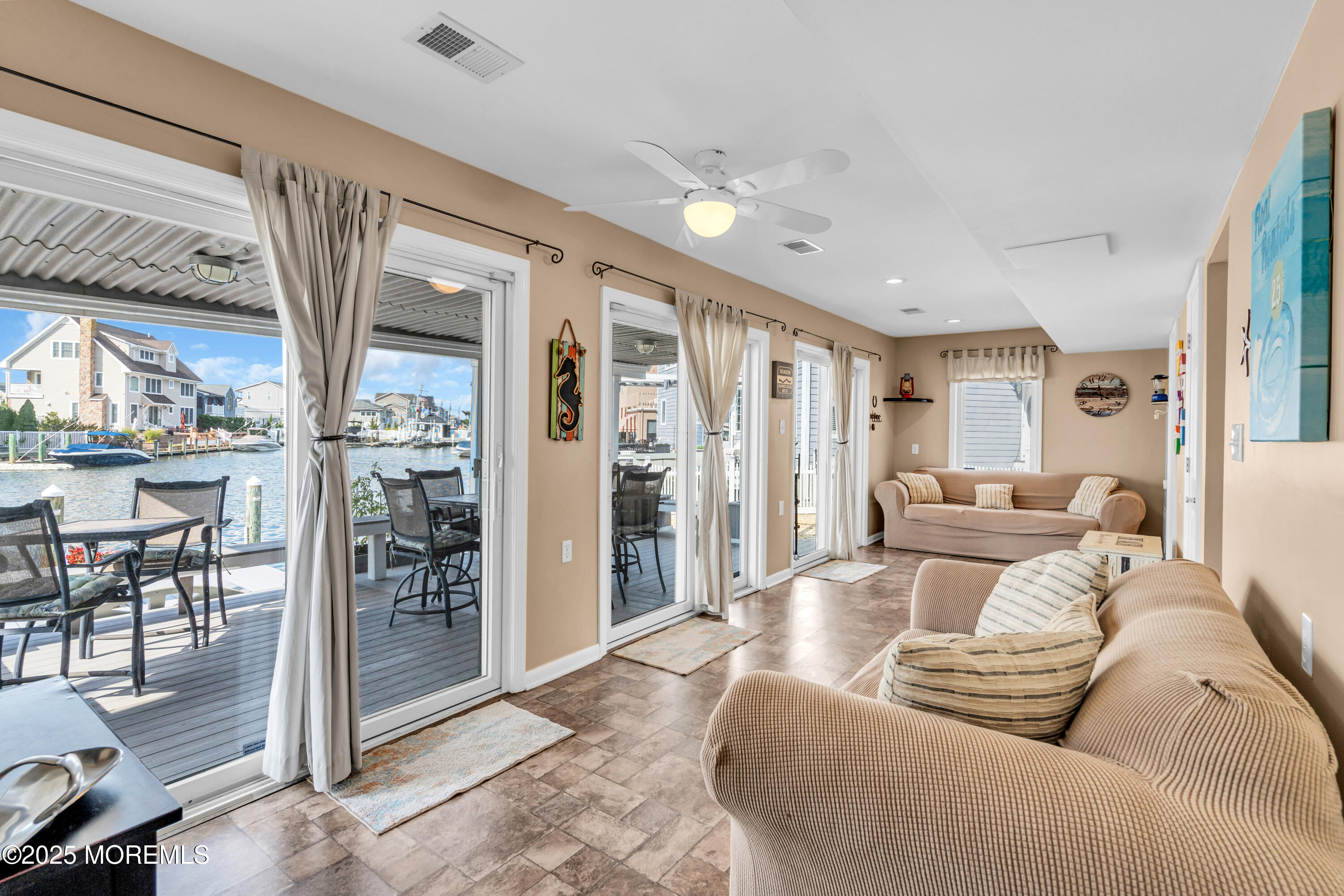 316 Ormond Drive Lavallette, NJ 08735 - Photo 23 of 29 a living room with furniture and a glass door