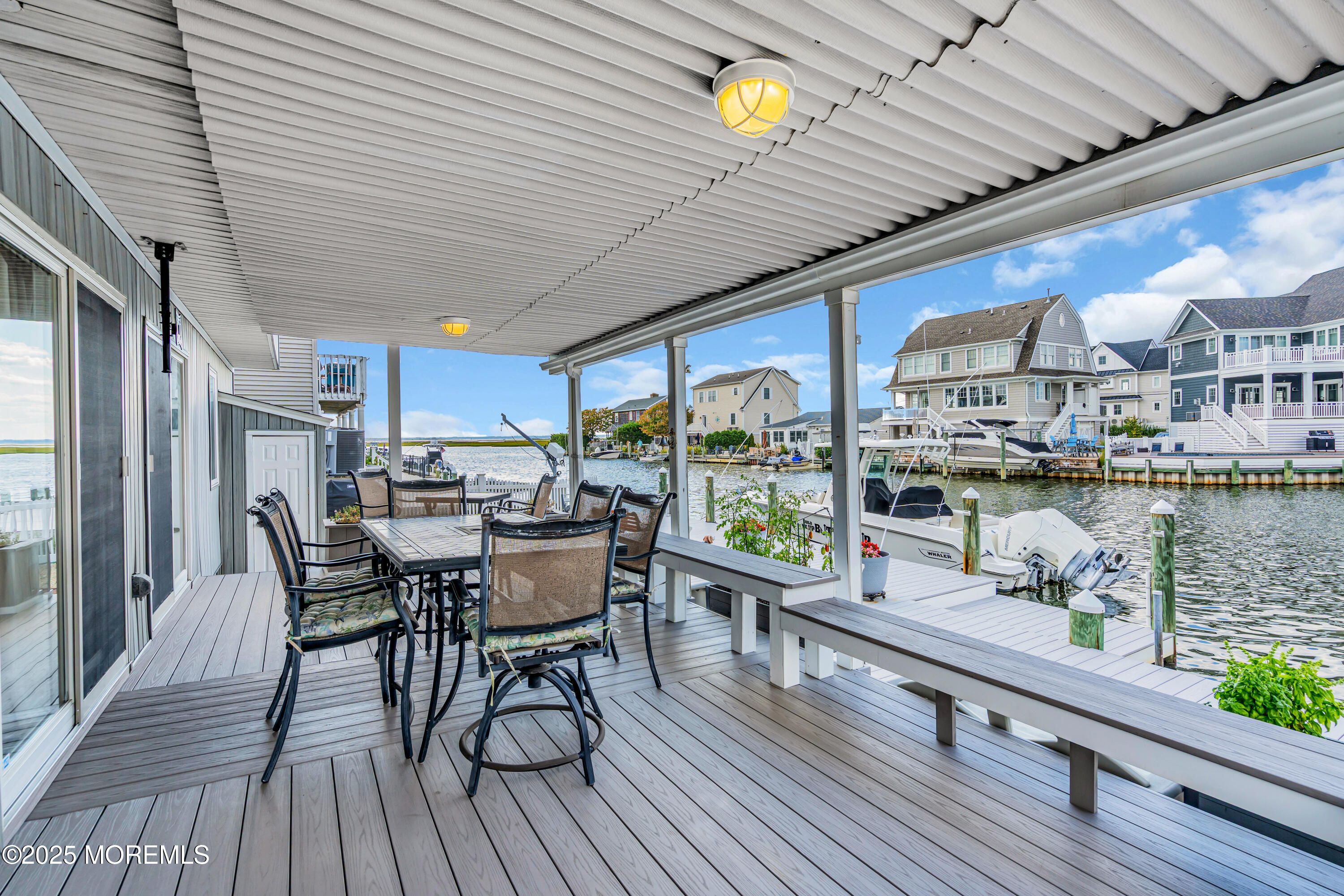 316 Ormond Drive Lavallette, NJ 08735 - Photo 24 of 29 a dining room with furniture and wooden floor