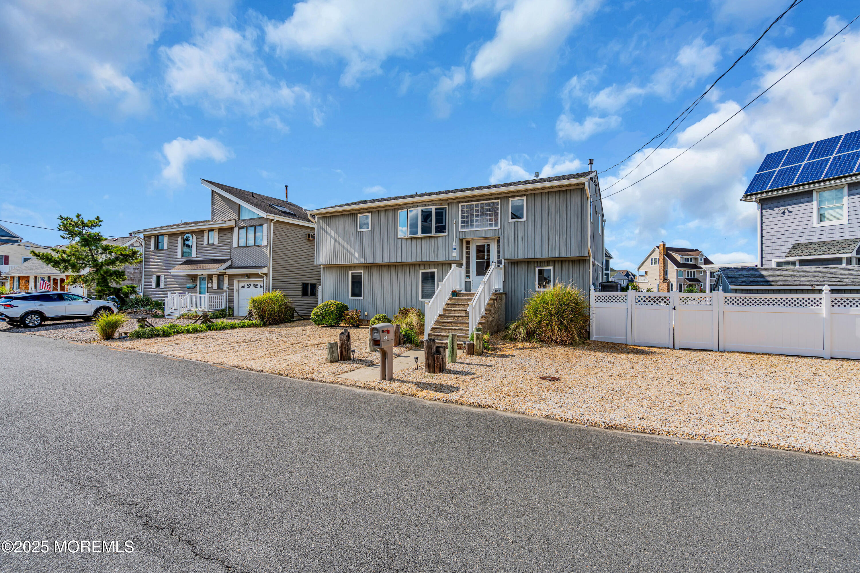 316 Ormond Drive Lavallette, NJ 08735 - Photo 3 of 29 a view of a street with cars