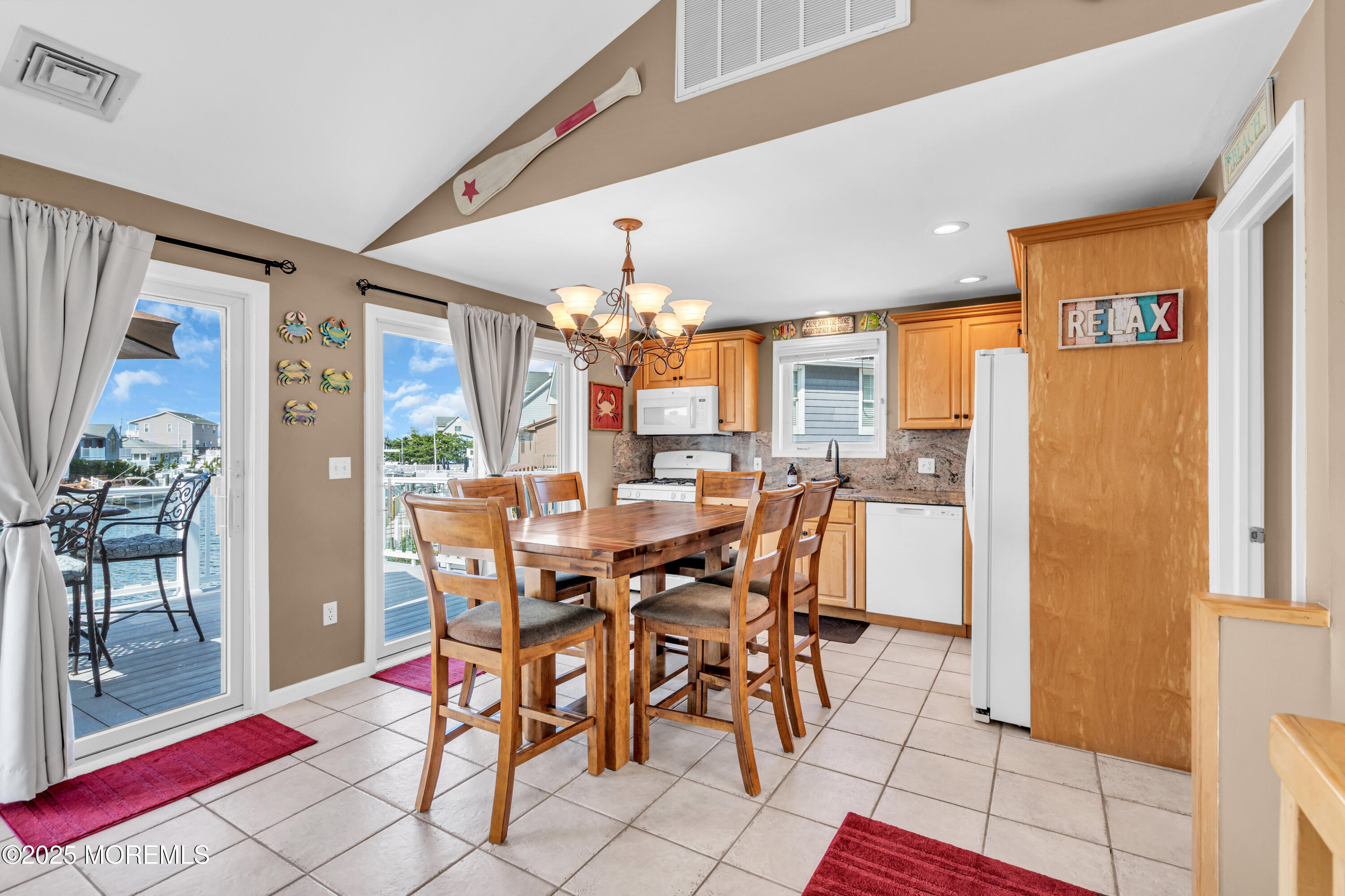 316 Ormond Drive Lavallette, NJ 08735 - Photo 8 of 29 a view of a dining room with furniture and chandelier