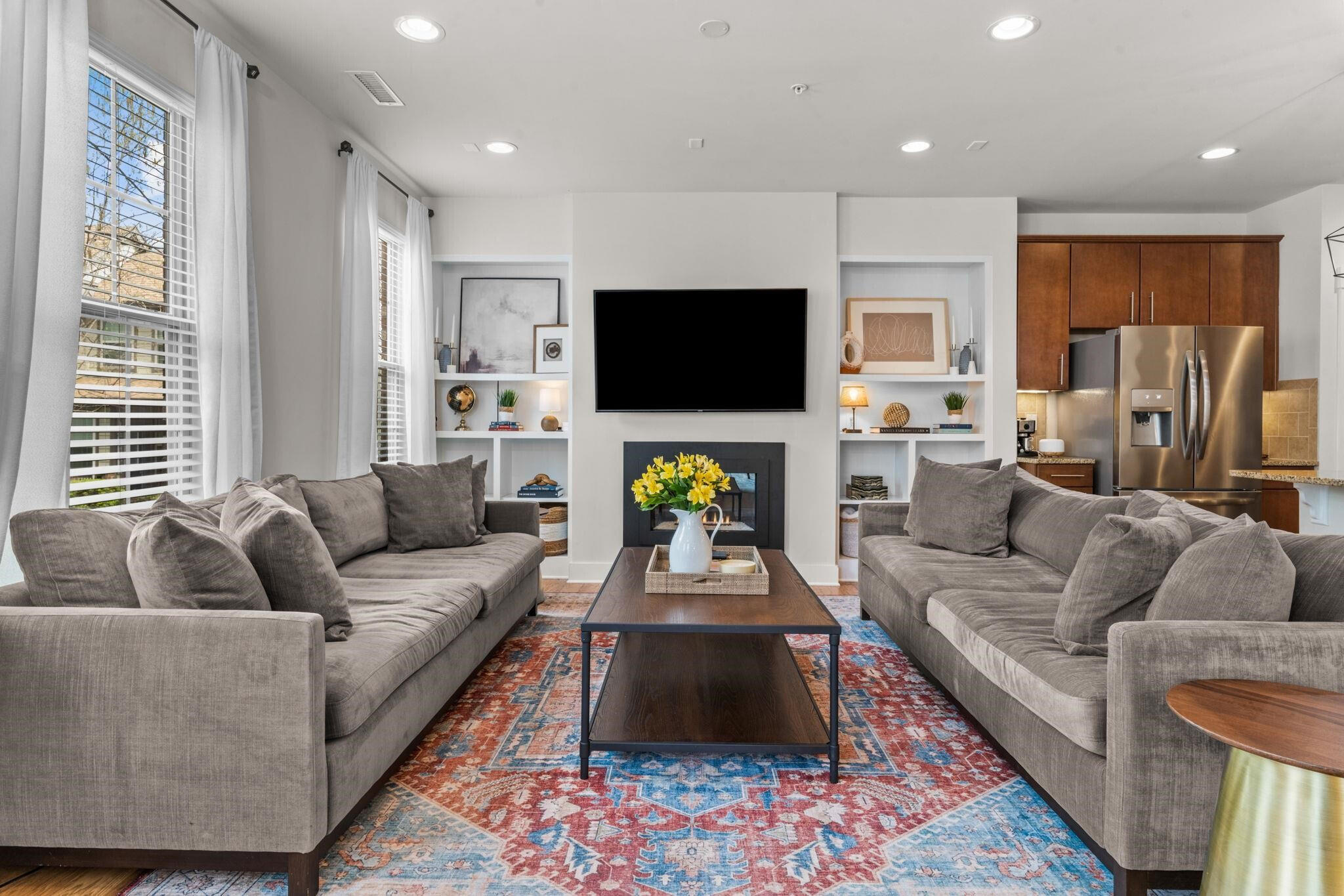 9304 Sevillanos Walk Raleigh, NC 27617 - Photo 12 of 41 a living room with furniture and a flat screen tv