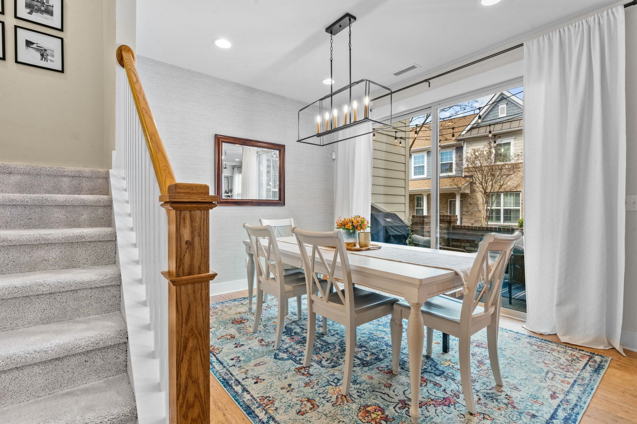 9304 Sevillanos Walk Raleigh, NC 27617 - Photo 17 of 41 a view of a dining room with furniture