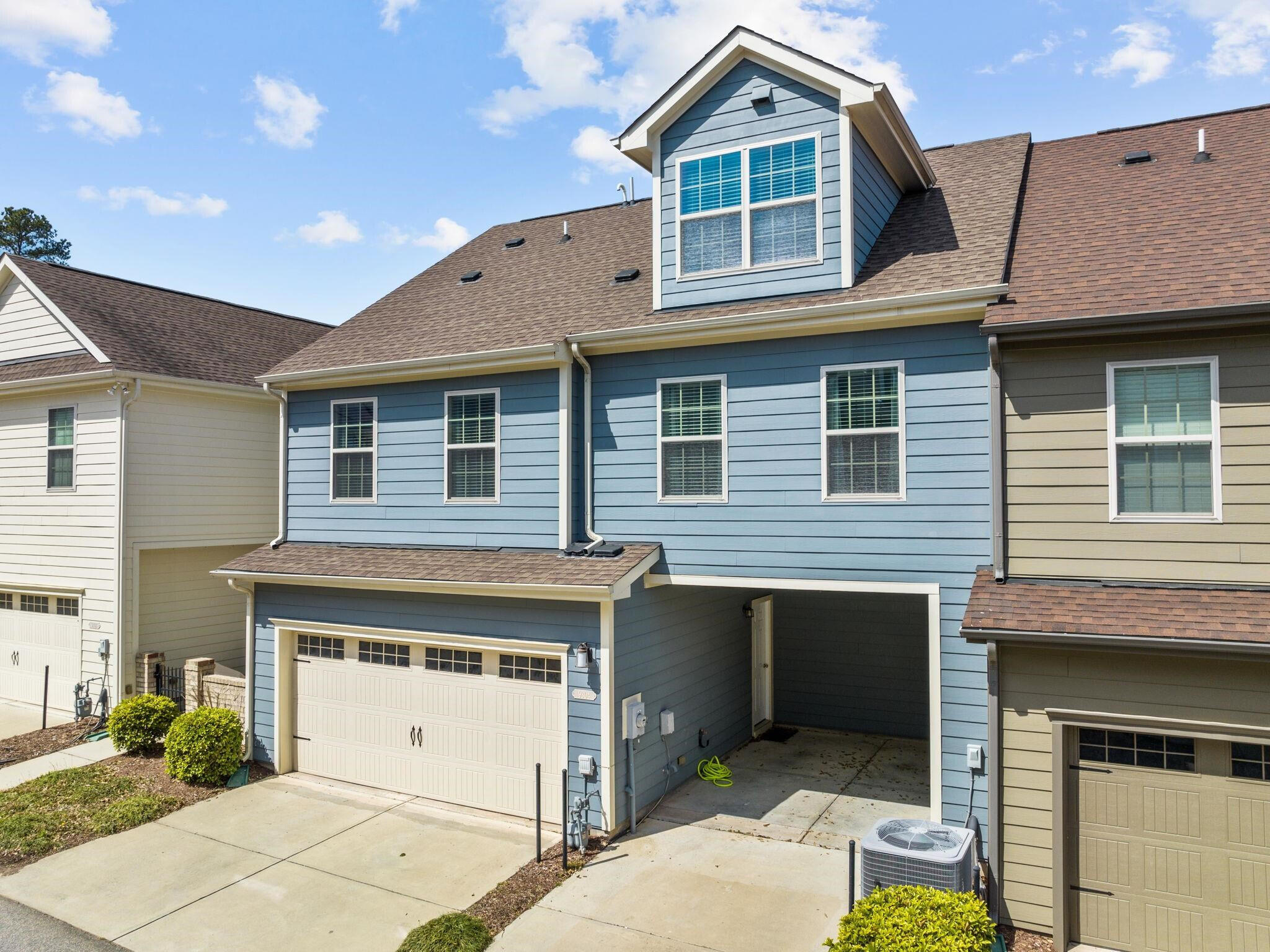 9304 Sevillanos Walk Raleigh, NC 27617 - Photo 2 of 41 a front view of a house with a garage
