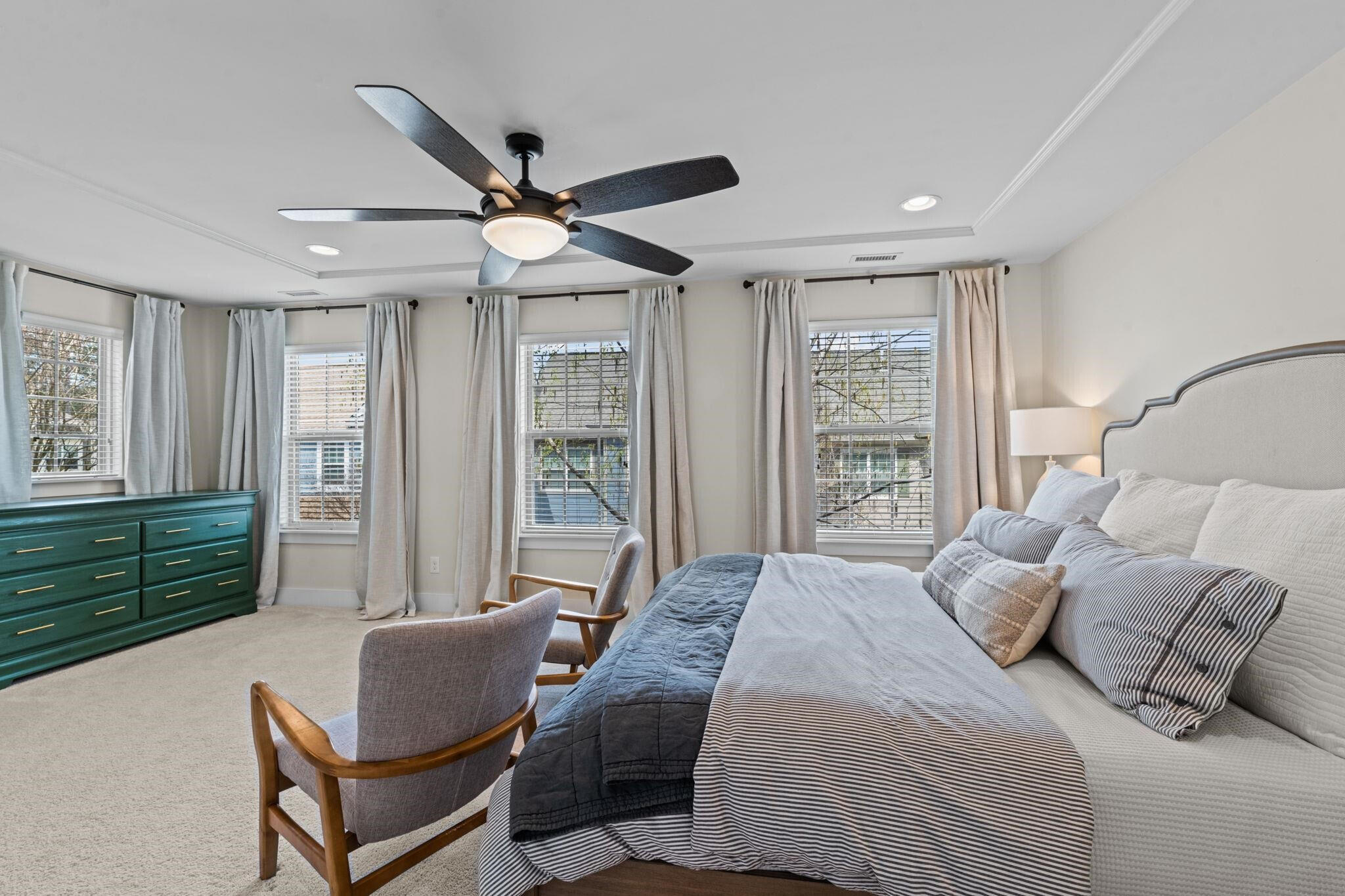 9304 Sevillanos Walk Raleigh, NC 27617 - Photo 21 of 41 a bedroom with a bed and a large window