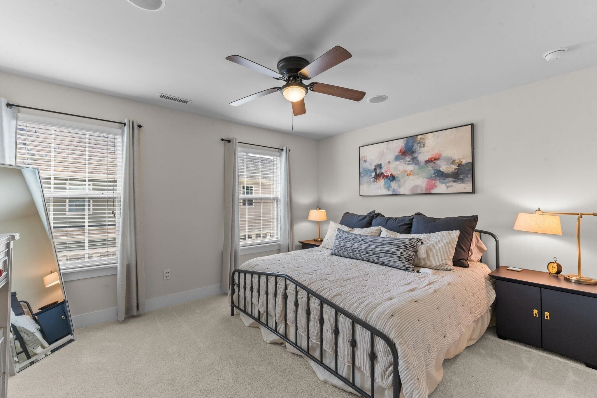 9304 Sevillanos Walk Raleigh, NC 27617 - Photo 27 of 41 a bedroom with a bed and a chandelier