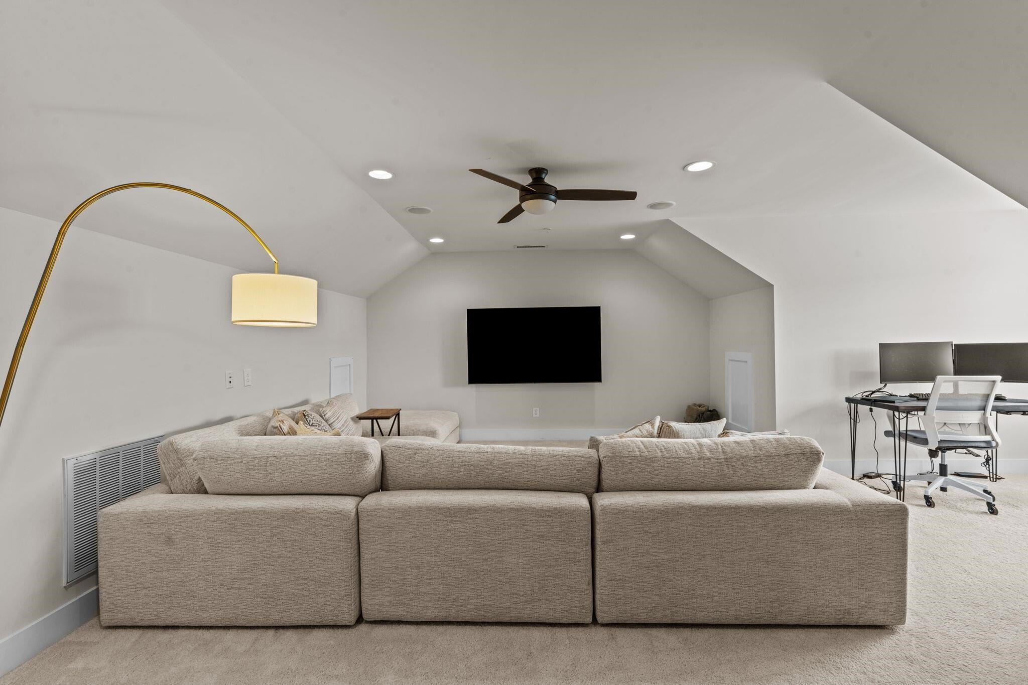 9304 Sevillanos Walk Raleigh, NC 27617 - Photo 31 of 41 a living room with furniture and a flat screen tv