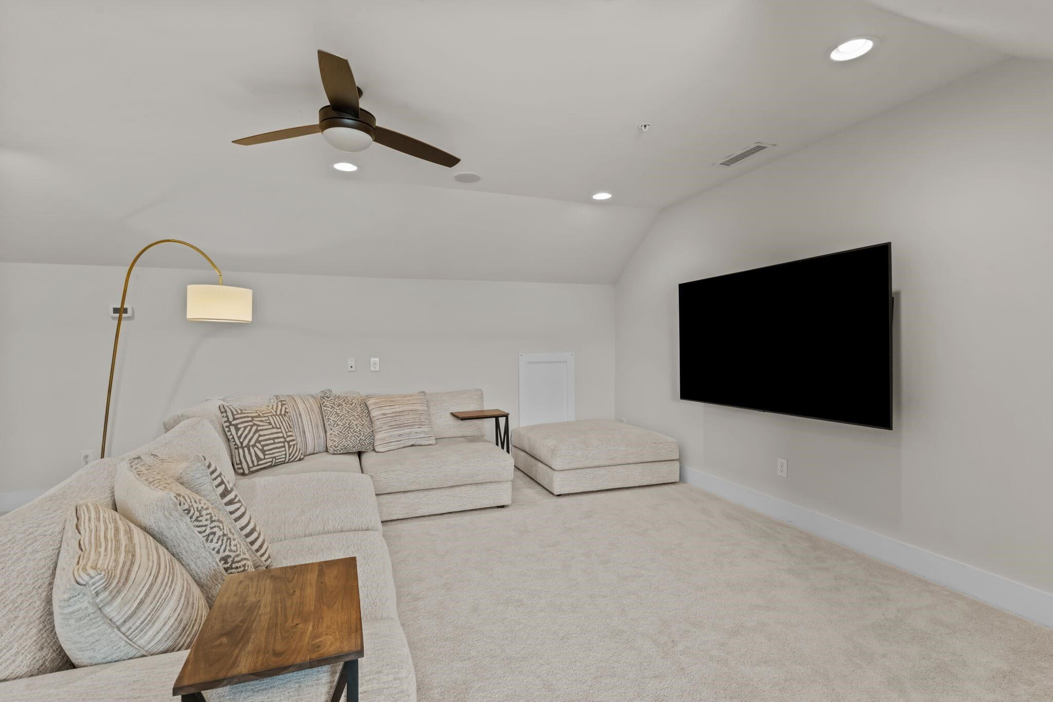 9304 Sevillanos Walk Raleigh, NC 27617 - Photo 33 of 41 a living room with furniture and a flat screen tv