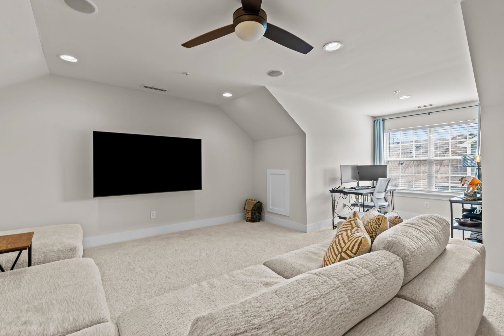9304 Sevillanos Walk Raleigh, NC 27617 - Photo 34 of 41 a living room with furniture and a flat screen tv