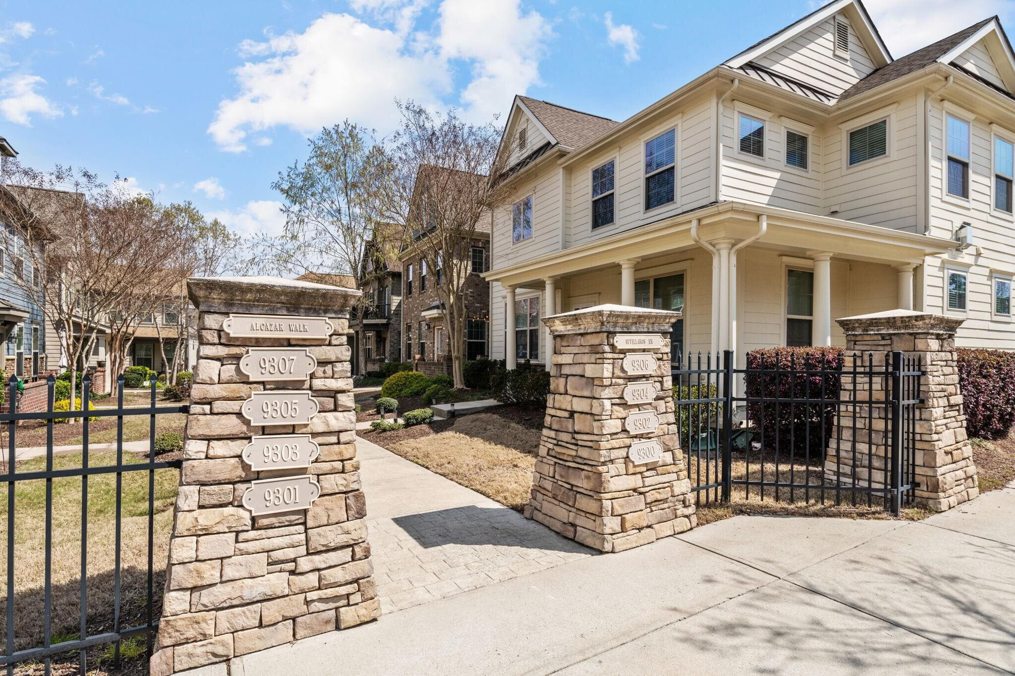 9304 Sevillanos Walk Raleigh, NC 27617 - Photo 40 of 41 a view of a brick house with many windows