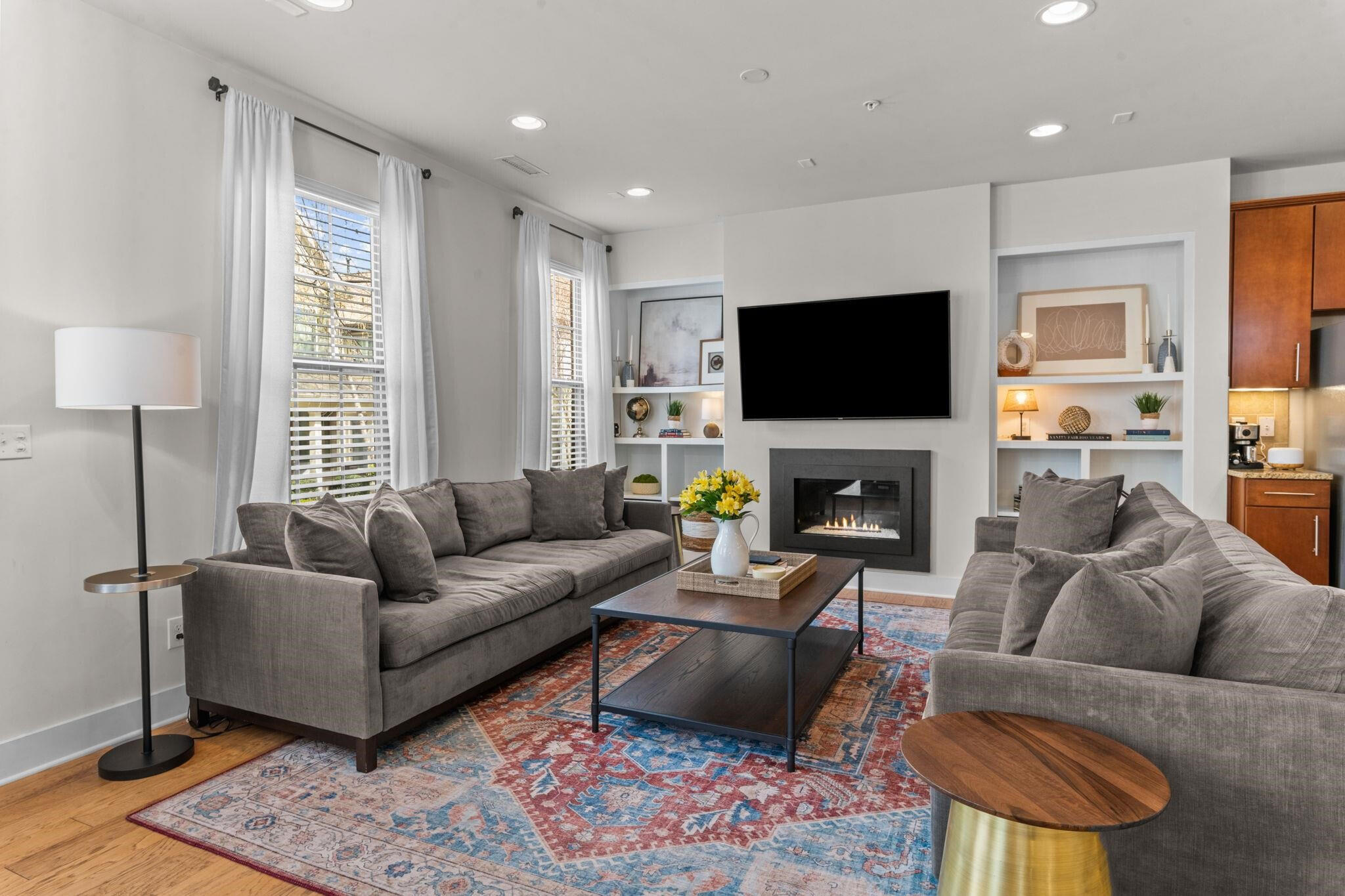 9304 Sevillanos Walk Raleigh, NC 27617 - Photo 8 of 41 a living room with furniture a flat screen tv and a fireplace