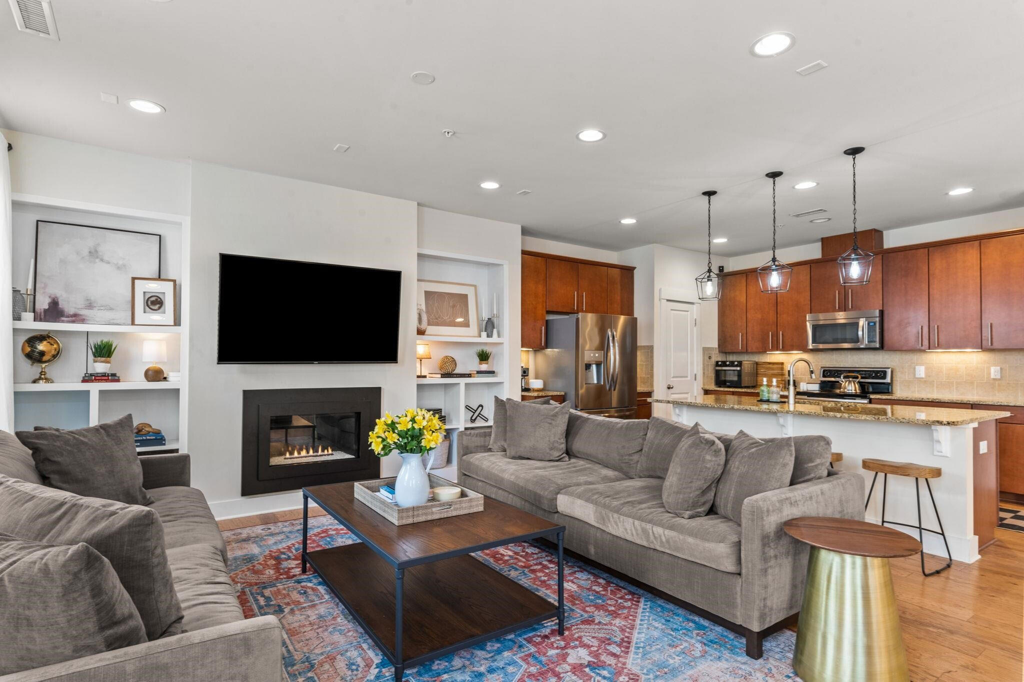 9304 Sevillanos Walk Raleigh, NC 27617 - Photo 9 of 41 a living room with fireplace furniture and a flat screen tv