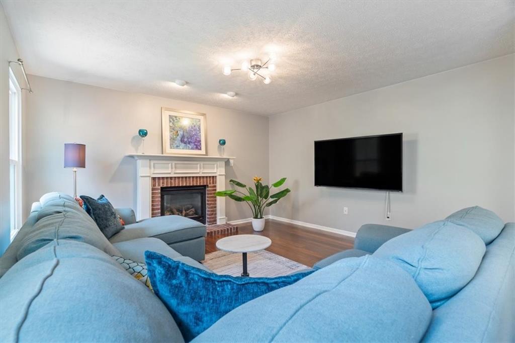 216 Lori Road Gibsonia, PA 15044 - Photo 19 of 50 Real hardwood underfoot. Statement lighting overhead. A layout that allows conversation between kitchen and lounge without feeling chaotic.