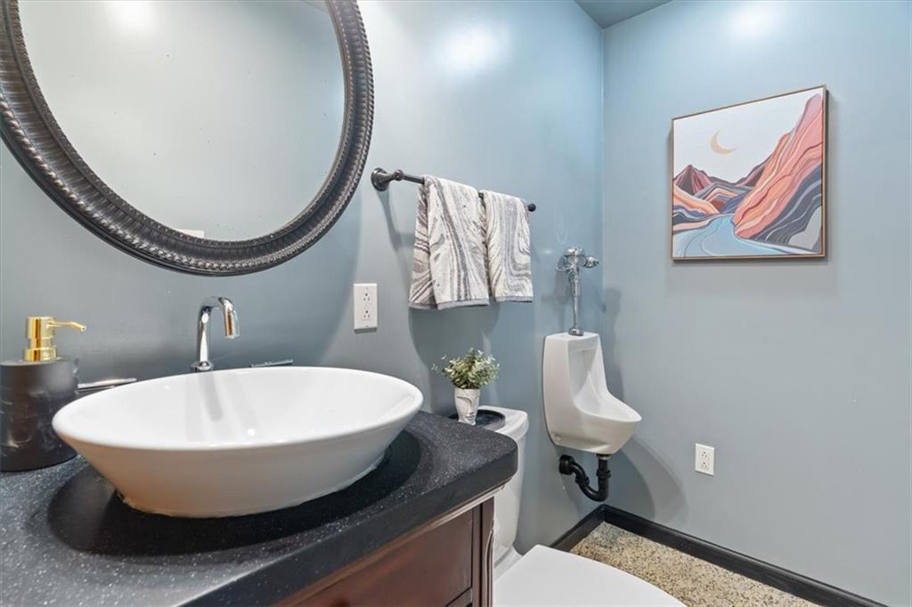 216 Lori Road Gibsonia, PA 15044 - Photo 44 of 50 Powder room with distinctive Nature Stone flooring for durability and texture.