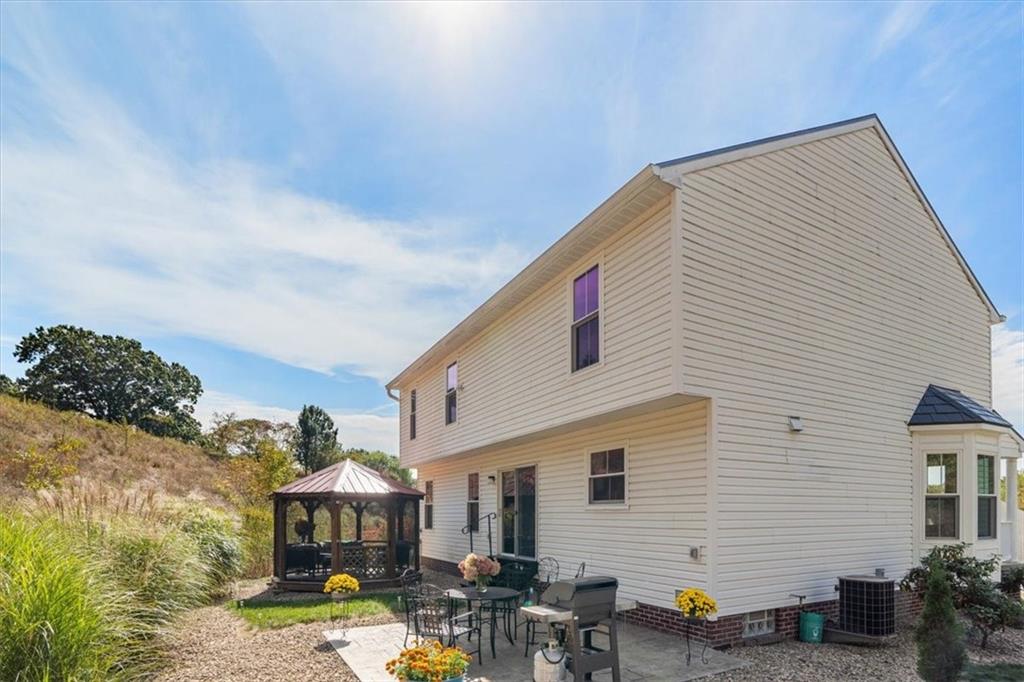 216 Lori Road Gibsonia, PA 15044 - Photo 45 of 50 Stamped concrete patio, not a builder-grade deck. Outdoor entertaining without excessive yard work. Low grass. Smart landscape strategy. High enjoyment.